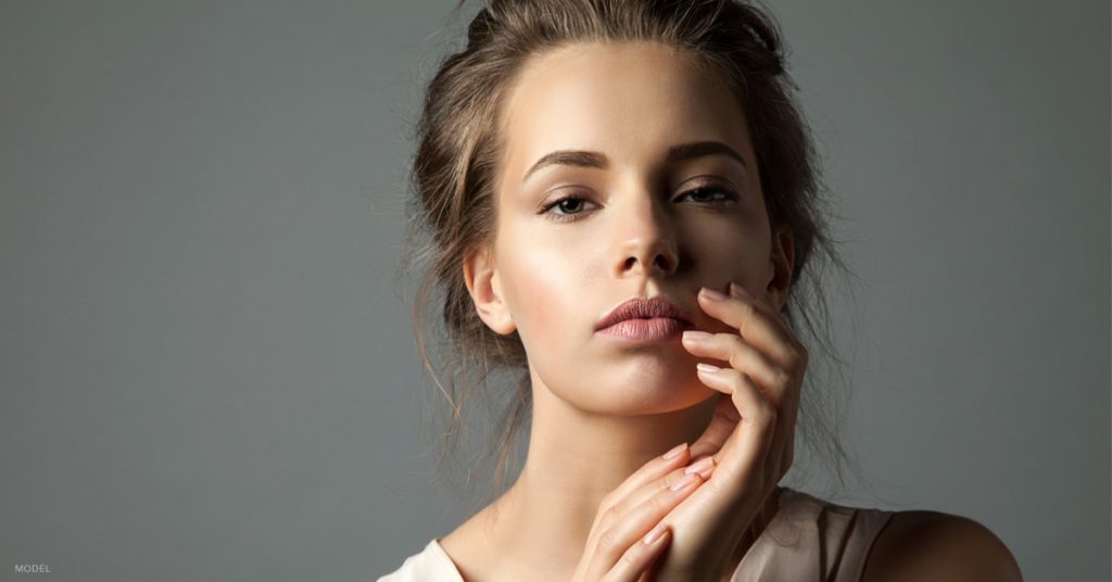 Young woman after a nonsurgical nose job with dermal fillers