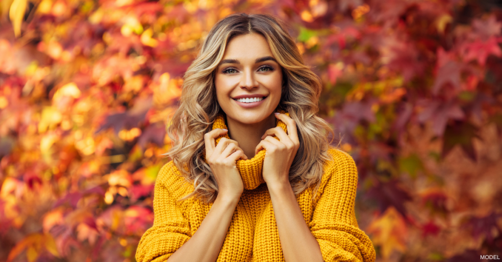 A woman pleased with her skin after getting a laser treatment in the fall.